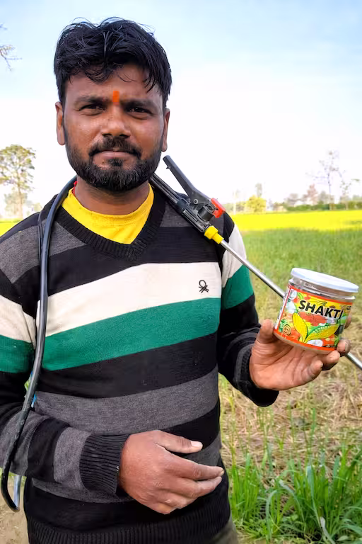 Farmer going to spray shakti in his crop